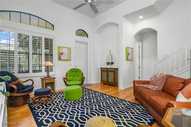 living room featuring light hardwood / wood-style floors and ceiling fan