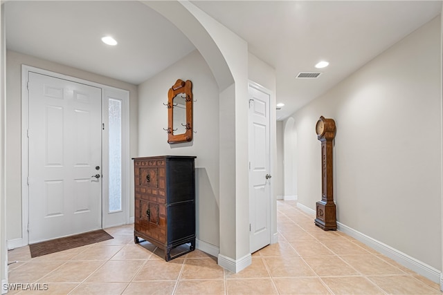 foyer with light tile patterned flooring