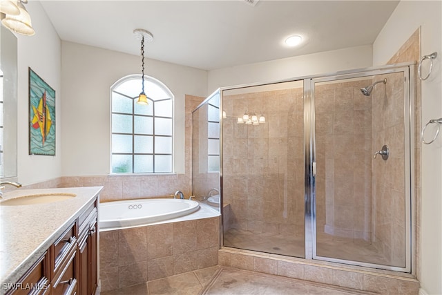 bathroom featuring independent shower and bath, vanity, and tile patterned floors