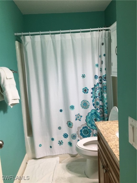 full bathroom with vanity, shower / bath combination with curtain, and toilet