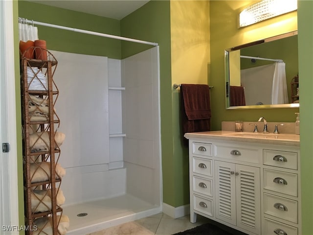 bathroom with vanity, a shower with shower curtain, and tile patterned floors