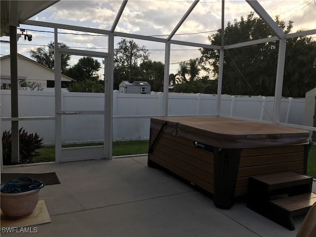 sunroom / solarium with a hot tub