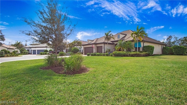 7788 Winding Cypress Dr, Naples, FL 34114 - view of front of home featuring stucco siding, driveway, a front lawn, and a garage
