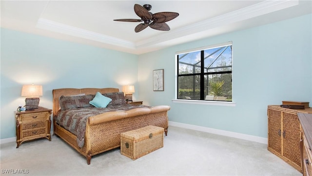 7788 Winding Cypress Dr, Naples, FL 34114 - bedroom featuring crown molding, a raised ceiling, baseboards, and light colored carpet