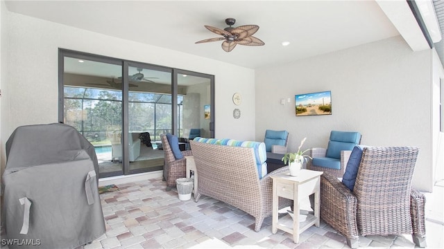 view of patio featuring ceiling fan and outdoor lounge area