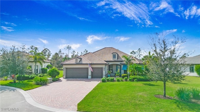 7788 Winding Cypress Dr, Naples, FL 34114 - view of front of property with driveway, a tile roof, a front yard, a garage, and stucco siding