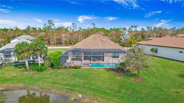 7788 Winding Cypress Dr, Naples, FL 34114 - back of property featuring a yard, a lanai, and an outdoor pool