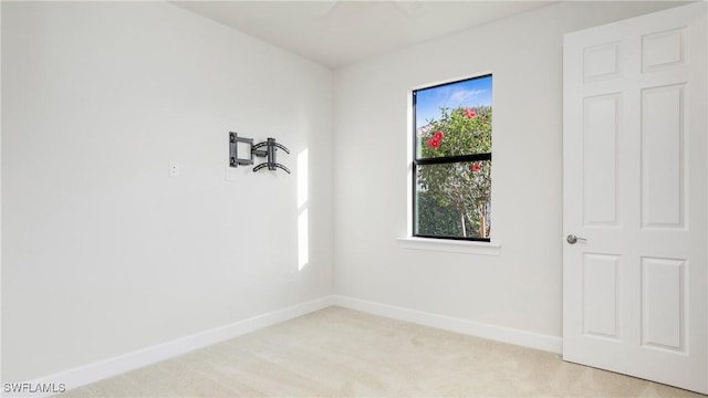7788 Winding Cypress Dr, Naples, FL 34114 - empty room with light colored carpet and baseboards