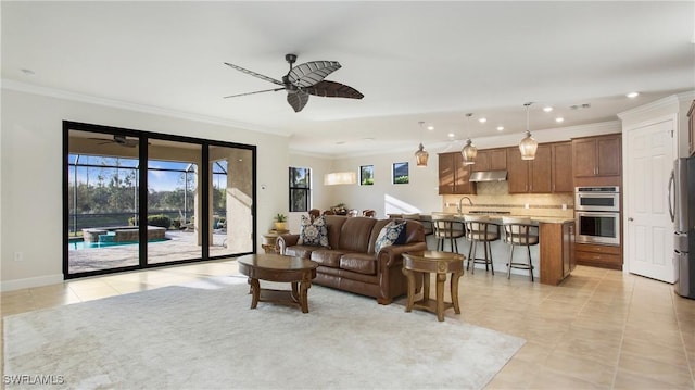 living room featuring ceiling fan, light tile patterned floors, and ornamental molding