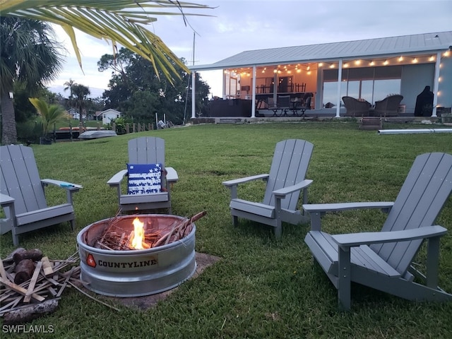 view of yard with a patio area and a fire pit