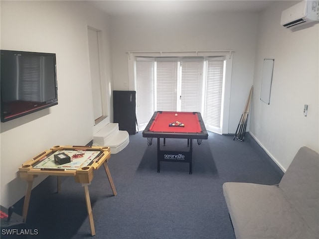 rec room with an AC wall unit and dark colored carpet