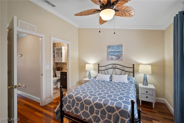 bedroom with dark wood-type flooring, ceiling fan, crown molding, and connected bathroom