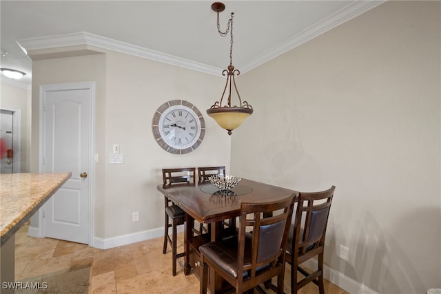 dining room featuring crown molding