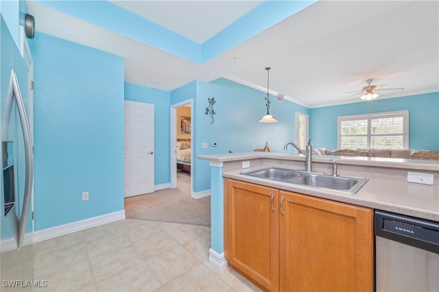 kitchen with stainless steel appliances, sink, ornamental molding, ceiling fan, and decorative light fixtures