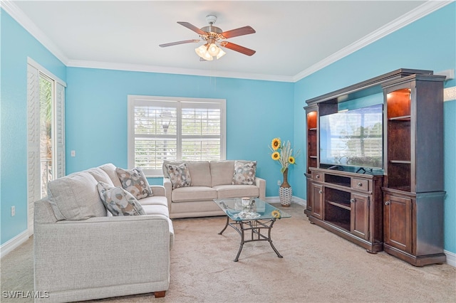 carpeted living room featuring ornamental molding and ceiling fan