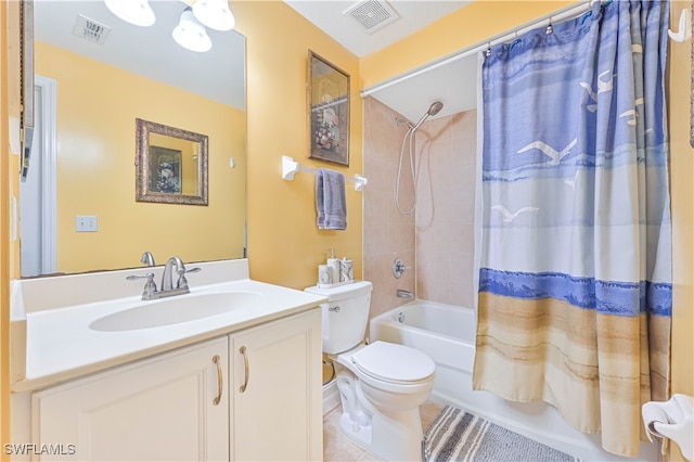 full bathroom with vanity, tile patterned floors, toilet, and shower / tub combo with curtain