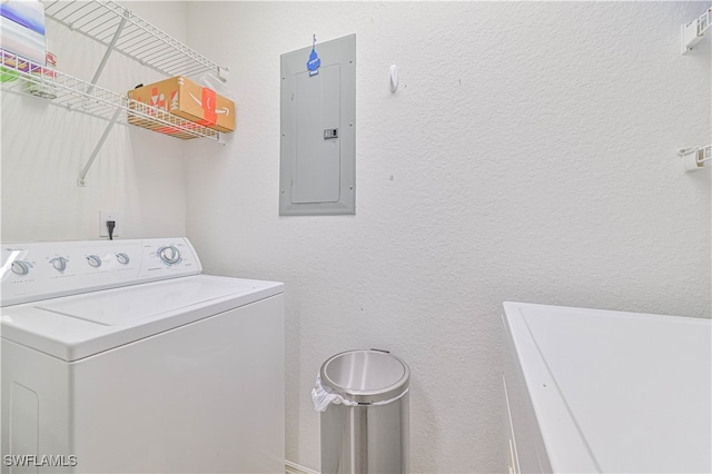 washroom with electric panel and washer / dryer