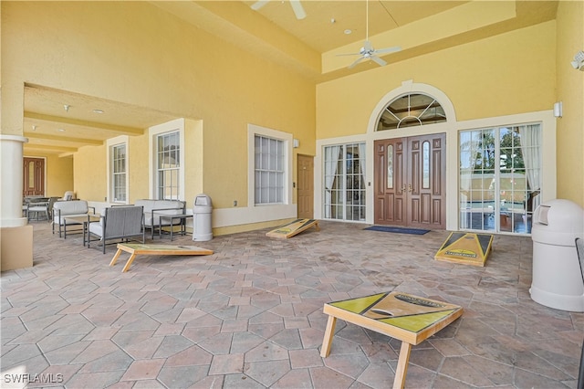 property entrance featuring a patio and ceiling fan