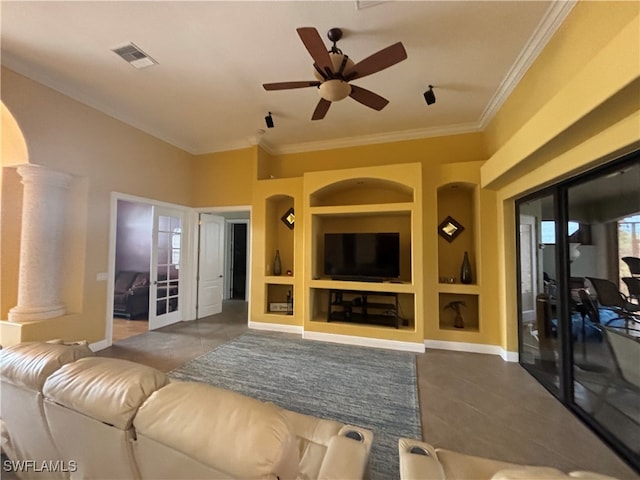 tiled living room with ceiling fan, crown molding, ornate columns, and built in shelves