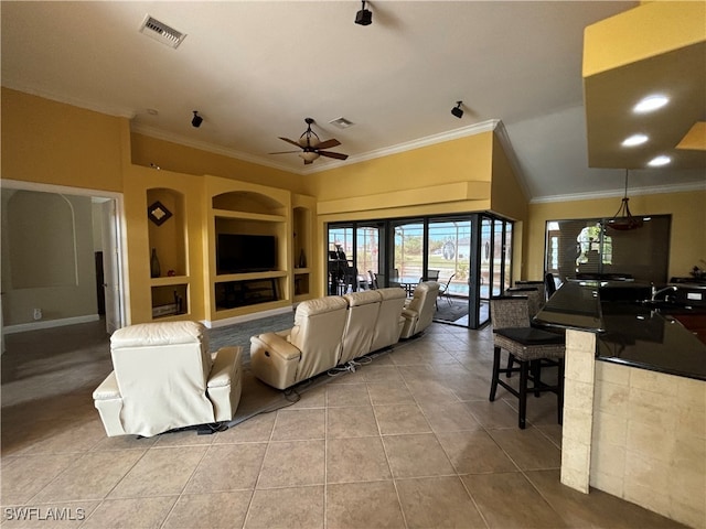 tiled living room featuring built in shelves, ornamental molding, and ceiling fan