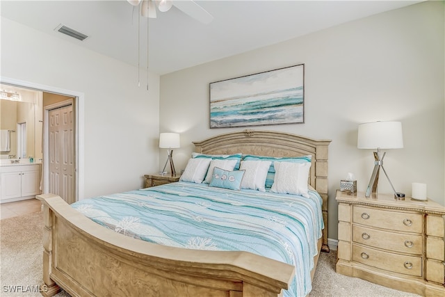 carpeted bedroom featuring ceiling fan, connected bathroom, and a closet