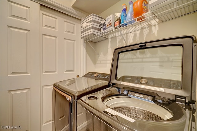 washroom with washer and dryer