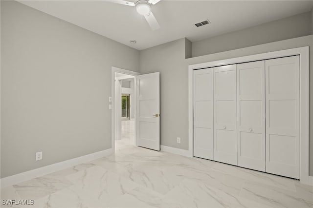 unfurnished bedroom featuring a closet and ceiling fan