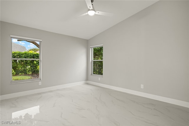 empty room featuring ceiling fan and lofted ceiling