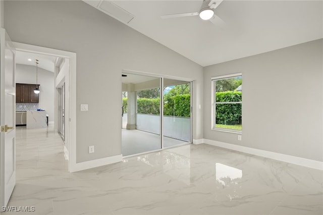 empty room with vaulted ceiling and ceiling fan