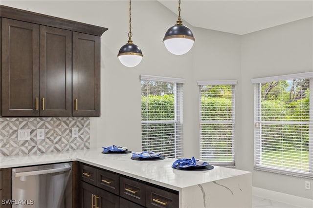 kitchen with a wealth of natural light, light stone countertops, and dishwasher