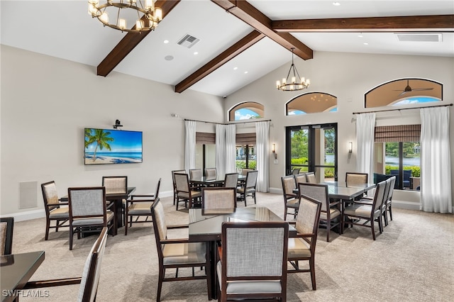 dining area with high vaulted ceiling, beamed ceiling, a wealth of natural light, and light colored carpet