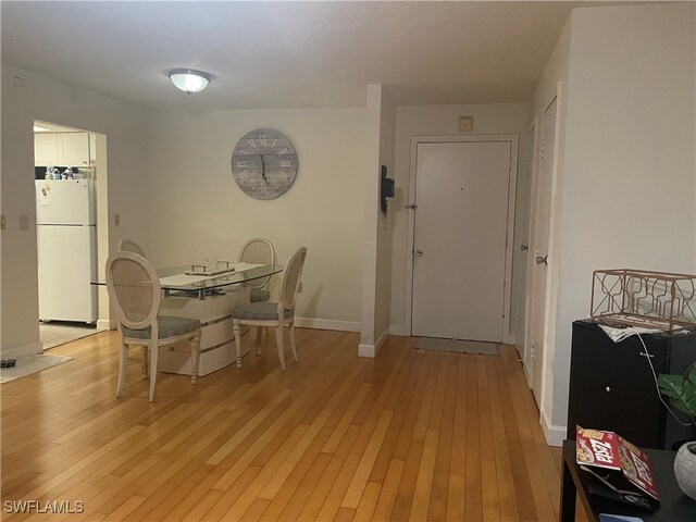 dining area featuring light wood-type flooring