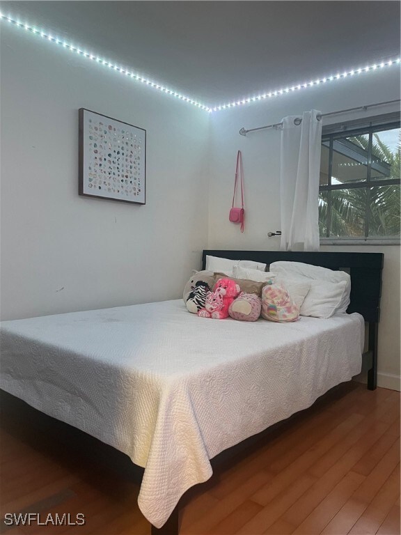 bedroom with wood-type flooring