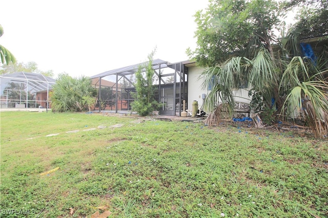 view of yard featuring glass enclosure