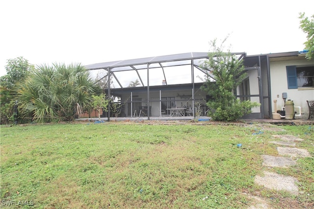 view of yard featuring glass enclosure