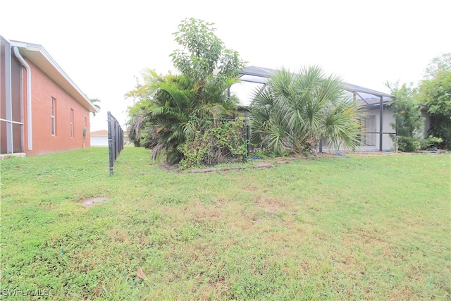 view of yard featuring a lanai