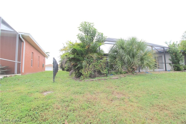 view of yard featuring a lanai