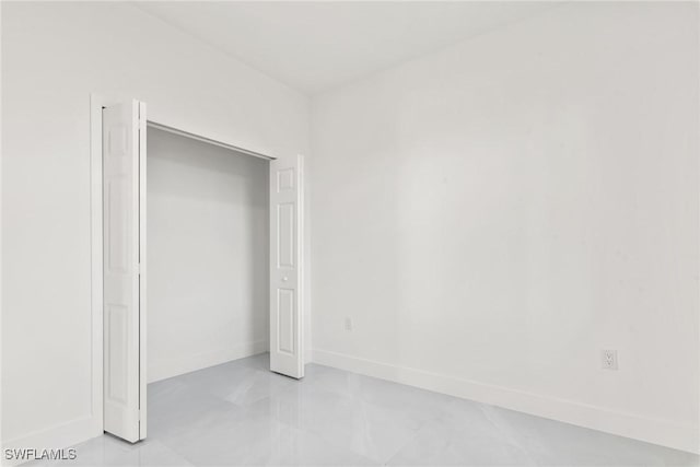 unfurnished bedroom with a closet