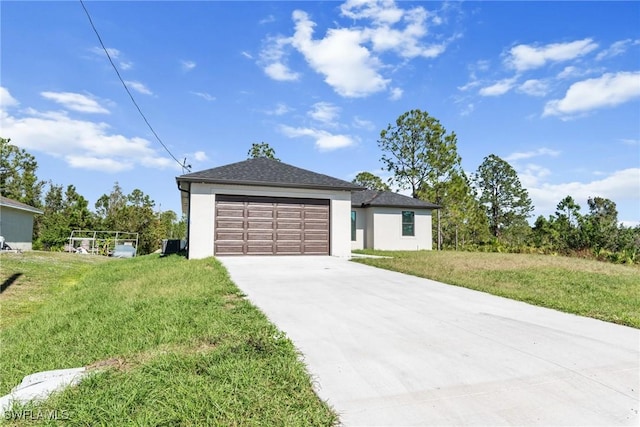 view of front of property featuring a garage and a front yard