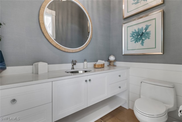 bathroom with vanity and toilet