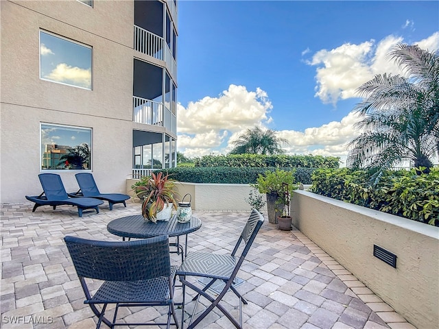 view of patio / terrace with a balcony