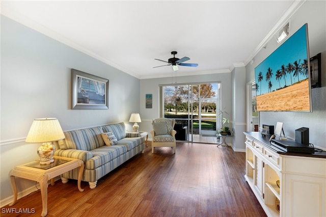 living room with crown molding, dark hardwood / wood-style floors, and ceiling fan