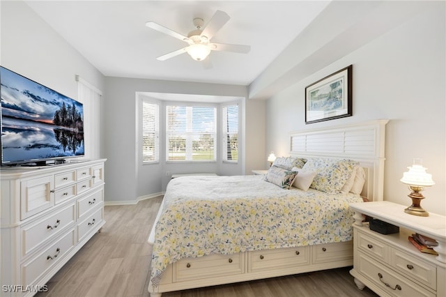 bedroom featuring light hardwood / wood-style floors and ceiling fan