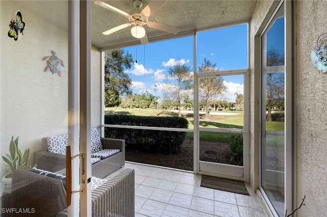 sunroom / solarium with ceiling fan