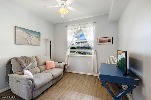 living room with hardwood / wood-style floors and ceiling fan