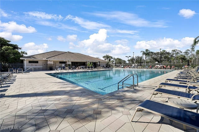 view of swimming pool with a patio area