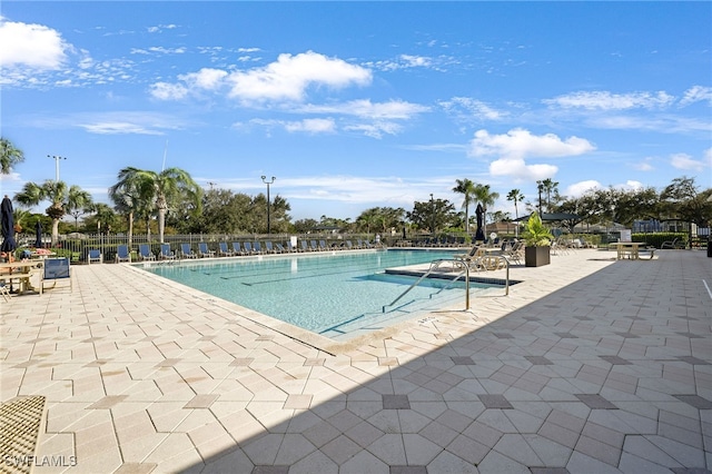 view of swimming pool with a patio