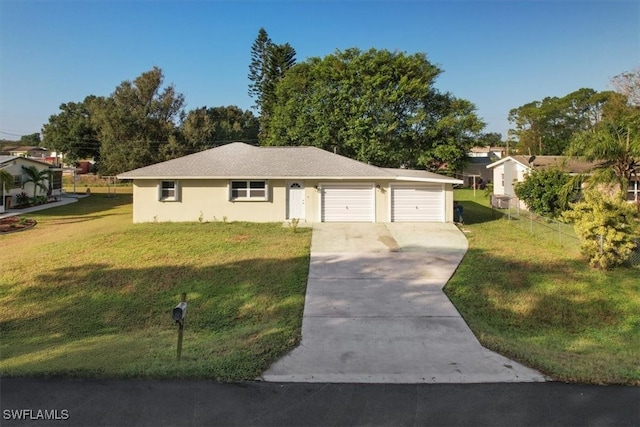 ranch-style home featuring a garage and a front lawn