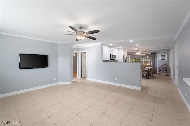 unfurnished living room with ceiling fan, light tile patterned floors, and ornamental molding