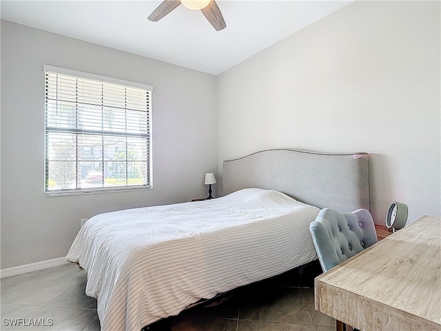 tiled bedroom with ceiling fan